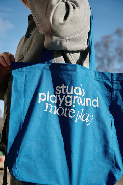 'more play' tote bag