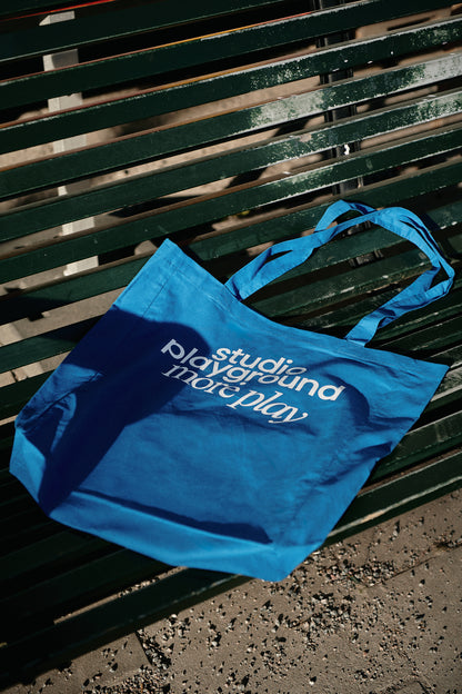 'more play' tote bag